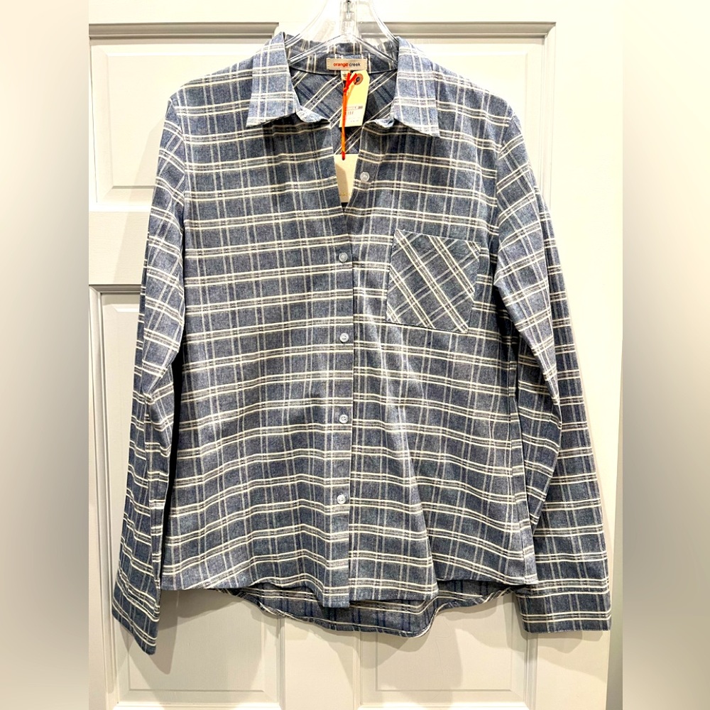 Women’s long sleeved button up shirt.